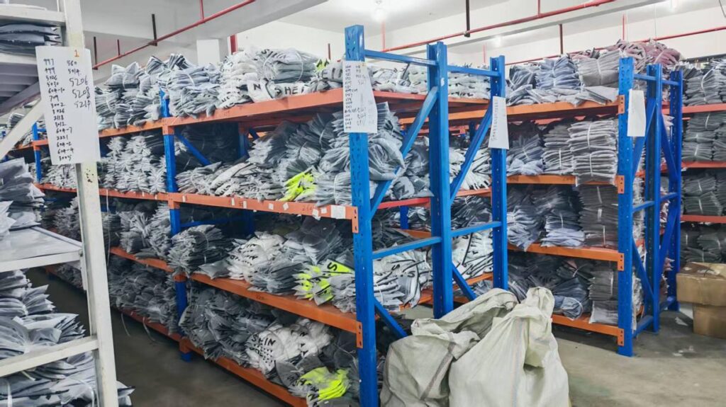 Finished activewear packed and shelved ready for shipment.