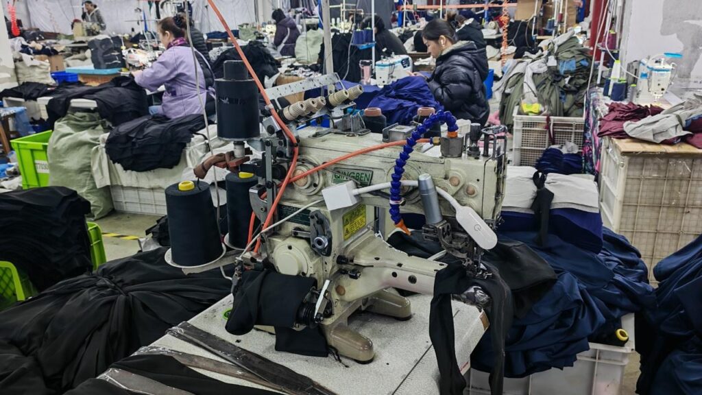 Double-needle sewing machine for reinforced, durable stitching.