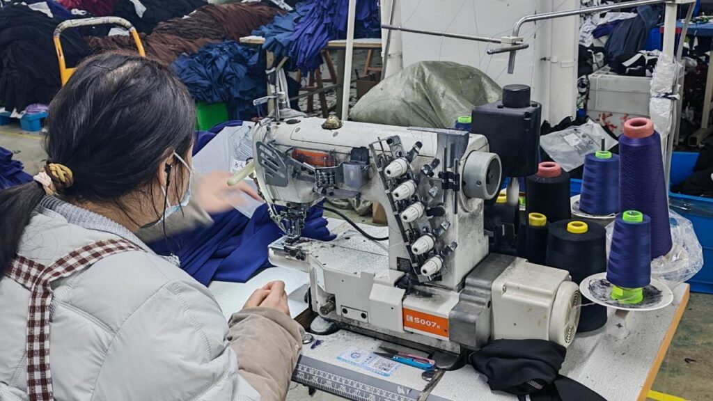 Coverstitch machine used for stretch hemming on leggings and tops.